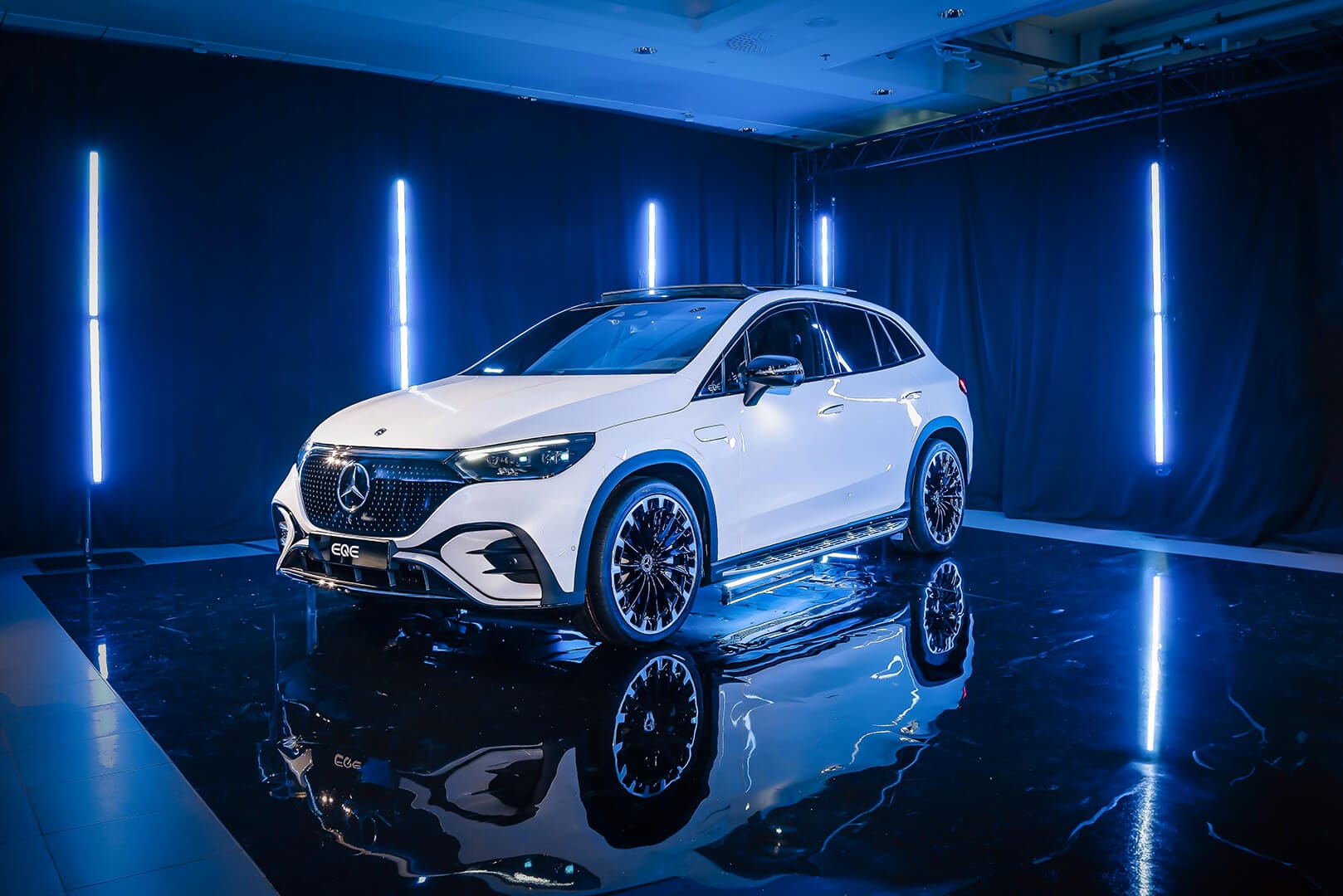 Mercedes-Benz EQE is blue lighted showroom